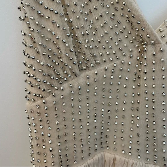 Free People Cream sparkly mini dress with a strappy back!
Size: 2 Never worn! - Picture 3 of 4